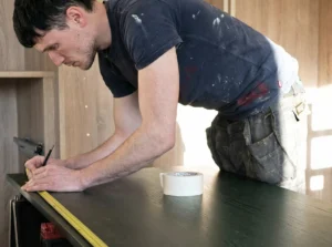 An image illustrating Kitchens4U’s measurement and kitchen installation service, ensuring accurate fitting and high-quality workmanship.