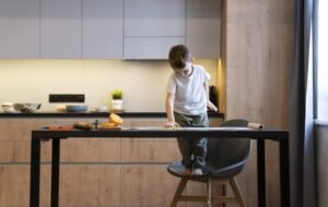 full shot kid alone kitchen