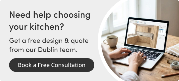 Kitchen designer creating a 3D kitchen plan on a laptop