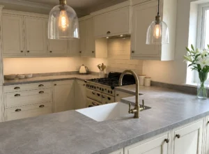 Grey laminate kitchen worktop with cream shaker cabinets for homes in Ireland