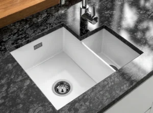White undermount kitchen sink in Dublin with black worktop.