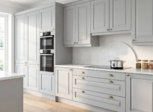 Light grey shaker kitchen cabinets with tall storage in a Dublin fitted kitchen