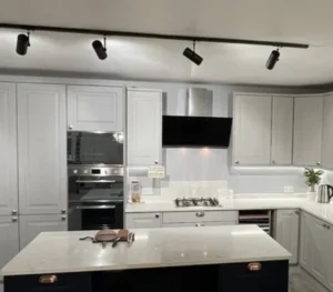 Light grey shaker kitchen cabinets with island in a modern Dublin home