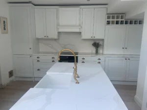 White shaker kitchen cabinets with brass handles in Dublin