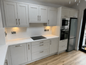 Grey shaker kitchen cabinets with white worktops in Rathmines, Dublin.