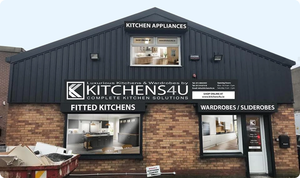 Front exterior of the Kitchens4U showroom in Dublin with large signage across the building