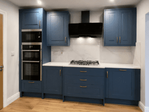 Cooking wall with Marine Blue shaker cabinetry and quartz worktops