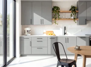 Modern kitchen renovation in Dublin with grey fitted cabinets, oak open shelving, white worktops and bright natural light