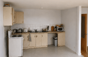 Before photo of an outdated cream kitchen prior to renovation in Lucan, Dublin