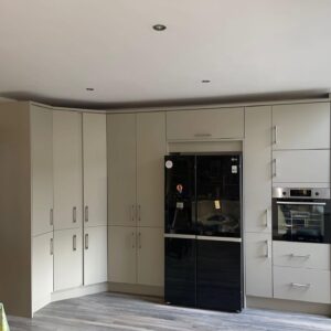Tall storage wall with fridge and integrated oven in a Portmarnock Dublin kitchen renovation