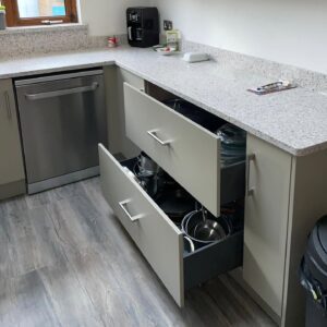 Deep pan drawers in a modern taupe slab kitchen renovation in Dublin