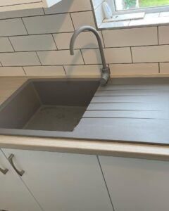 Grey composite sink and matching tap in a Santry Dublin kitchen