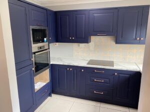 Indigo blue Shaker kitchen cooking wall with quartz worktops in Clontarf, Dublin