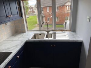 Indigo blue Shaker kitchen sink area under the window in Clontarf, Dublin