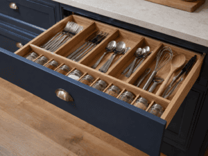 Organised kitchen drawer with wooden dividers for cutlery and utensils in Dublin