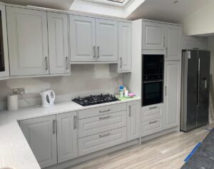 Light grey Shaker kitchen with tall appliance wall in Glasnevin, Dublin