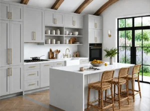 Light grey Shaker kitchen units with island, tall cabinets and wall storage in Dublin