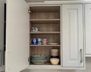 Open wall cabinet storage in a light grey Shaker kitchen in Glasnevin, Dublin
