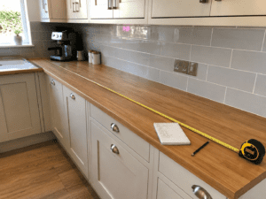 Measuring a kitchen countertop before replacement in a Dublin home