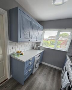 Opposite storage run with under-counter appliance in a compact Raheny galley kitchen