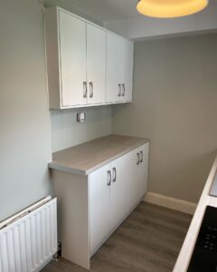 Opposite-side storage and worktop in a compact galley kitchen in Santry