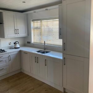 White grey Shaker sink wall with tall storage in Raheny, Dublin
