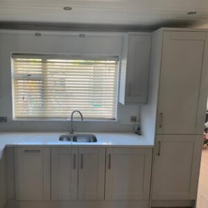 White grey Shaker sink wall with tall storage in Raheny, Dublin