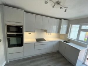 White high gloss handleless L-shaped kitchen renovation in Malahide, Dublin