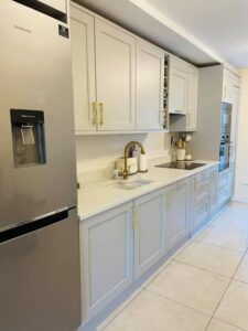 Side view of a light grey one-wall Shaker kitchen in Blackrock, Dublin
