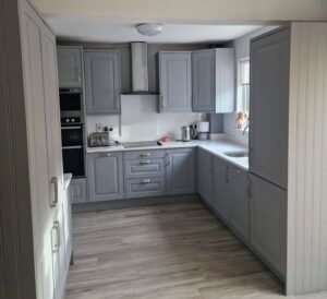Dust Grey shaker U-shaped kitchen in Raheny, Dublin, with white quartz worktops